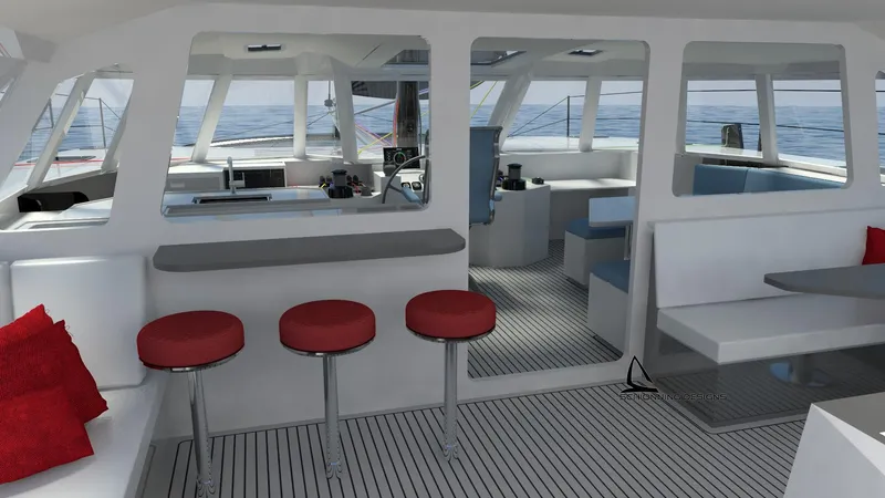 Slide: The Image of Interior of 2025 Razor Cat 52 Sailing Catamaran with modern seating and ocean view. - 9