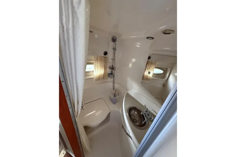 Slide: The Image of Bathroom interior of 2003 Chaparral Signature 320 yacht, featuring shower and sink. - 15