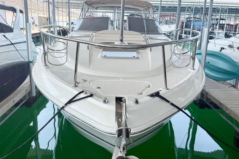The Image of 2003 Chaparral Signature 320 boat docked in marina, front view. - 1