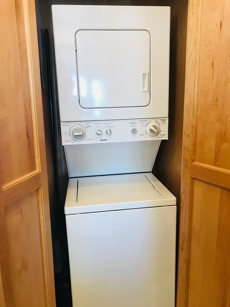 Slide: The Image of Stacked washer and dryer in wooden closet, Stardust Cruisers 2005 model. - 14