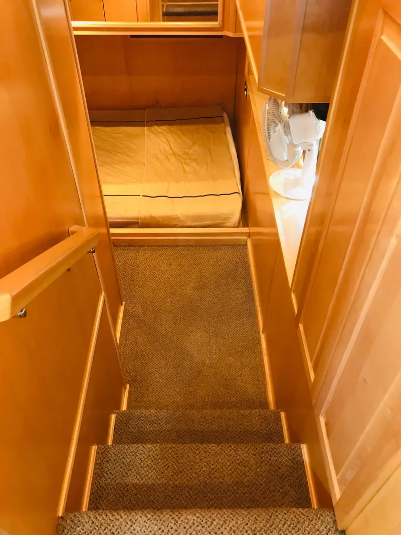 Slide: The Image of Interior of 2005 Stardust Cruisers Summer Obsession, featuring cozy cabin and stairs. - 16