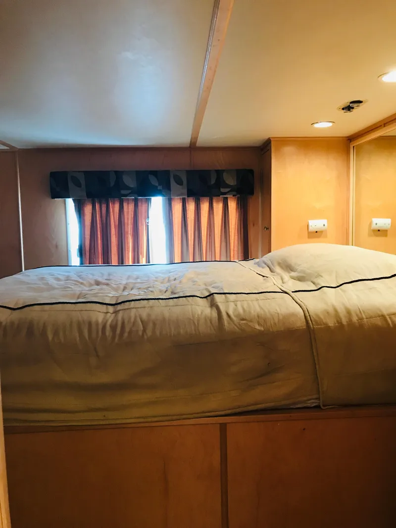 Slide: The Image of Cozy bedroom in 2005 Stardust Cruisers Summer Obsession houseboat with window view. - 18