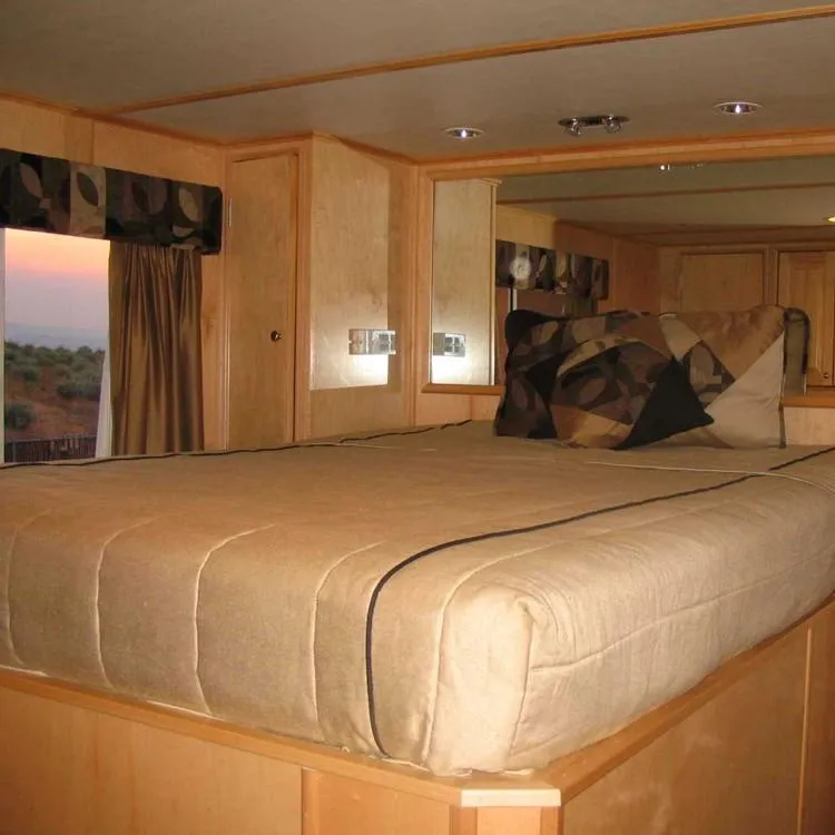 Slide: The Image of Luxurious bedroom interior of 2005 Stardust Cruisers Summer Obsession houseboat, featuring elegant bedding. - 20