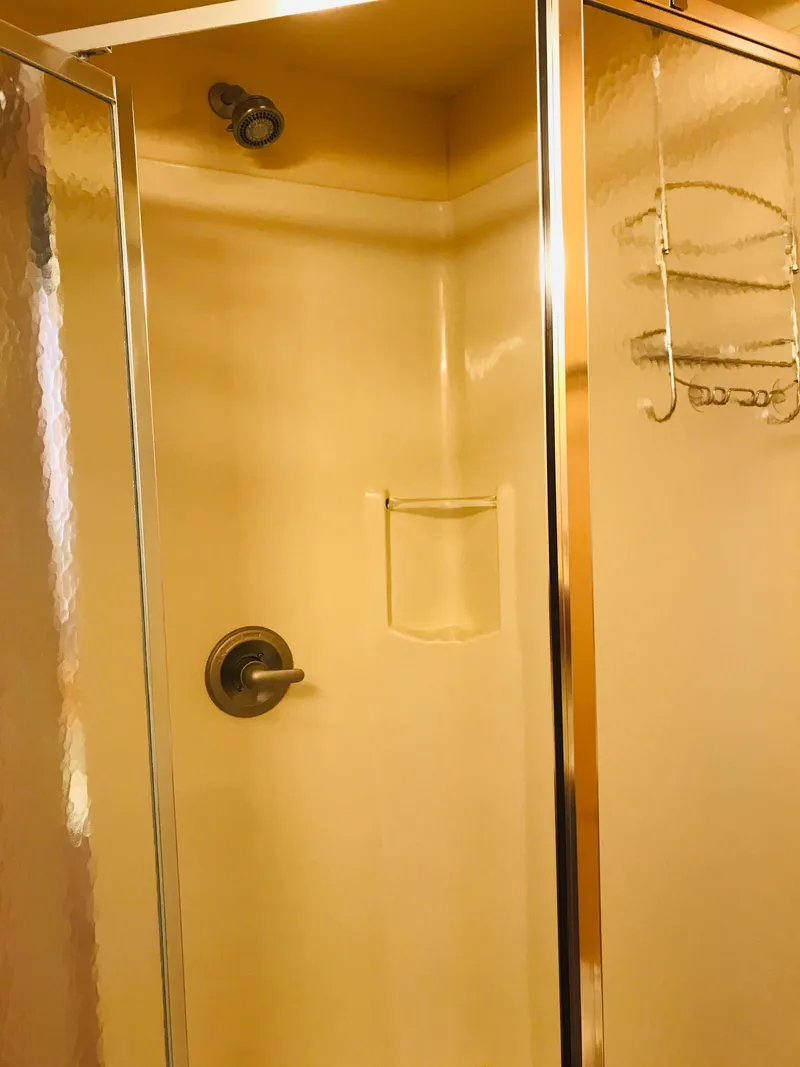 Slide: The Image of Shower interior in 2005 Stardust Cruisers Summer Obsession, featuring glass door and wall-mounted fixtures. - 34