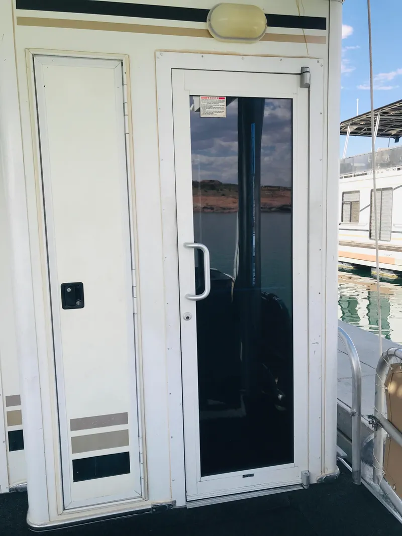 Slide: The Image of 2005 Stardust Cruisers Summer Obsession Share #37 houseboat door with reflective glass. - 36
