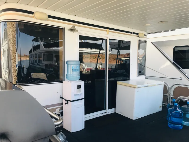 Slide: The Image of 2005 Stardust Cruisers houseboat with water cooler and storage on deck. - 37