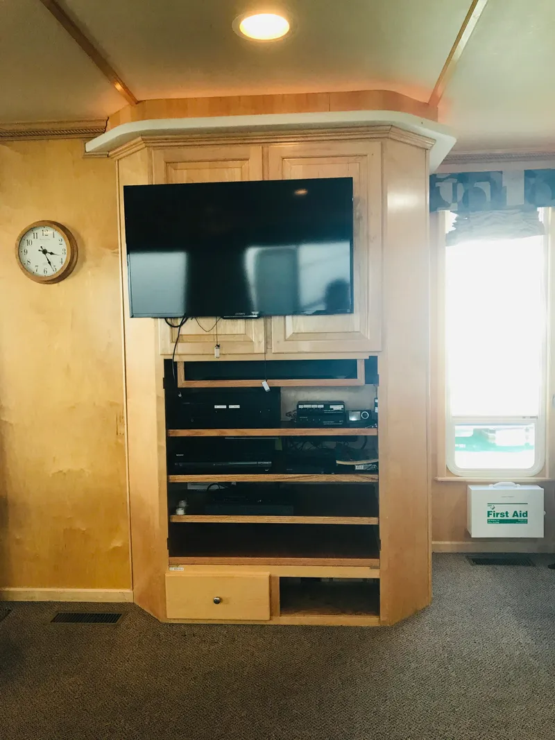 Slide: The Image of Entertainment center in 2005 Stardust Cruisers Summer Obsession Share #37 houseboat interior. - 6