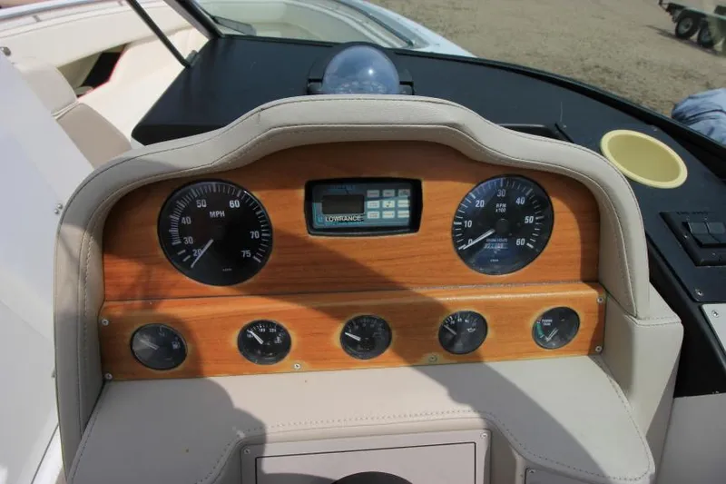 Slide: The Image of Dashboard of a 1997 Cobalt 272 BR boat with gauges and controls. - 15