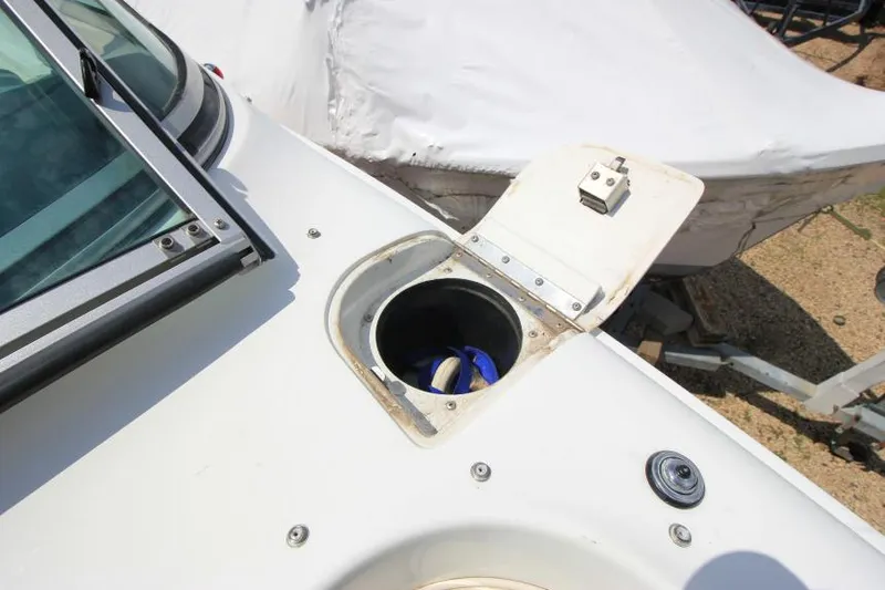 Slide: The Image of Open hatch on 1997 Cobalt 272 BR boat, revealing storage compartment. - 24