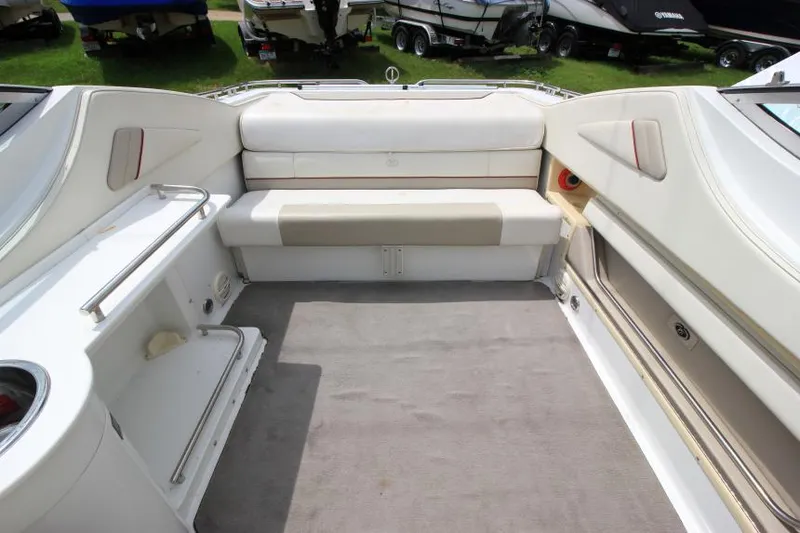 Slide: The Image of Interior of a 1997 Cobalt 272 BR boat with white seating and carpeted floor. - 3