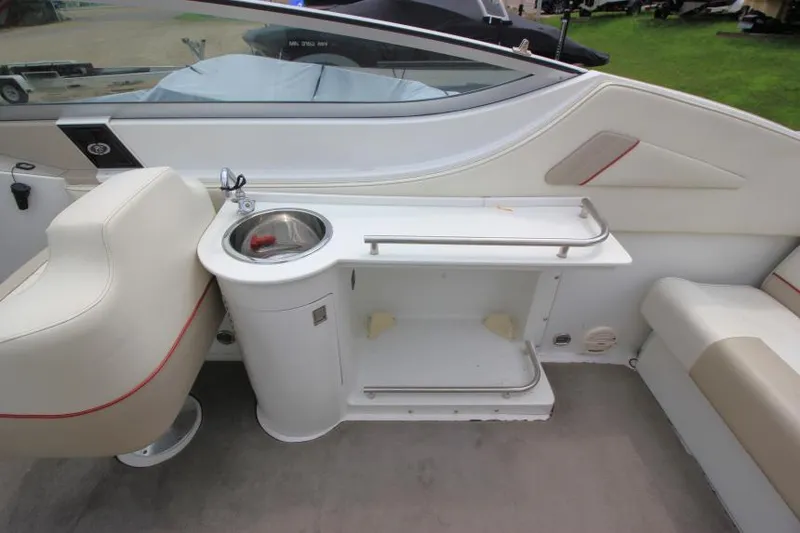 Slide: The Image of Interior of a 1997 Cobalt 272 BR boat featuring a sink and seating area. - 8