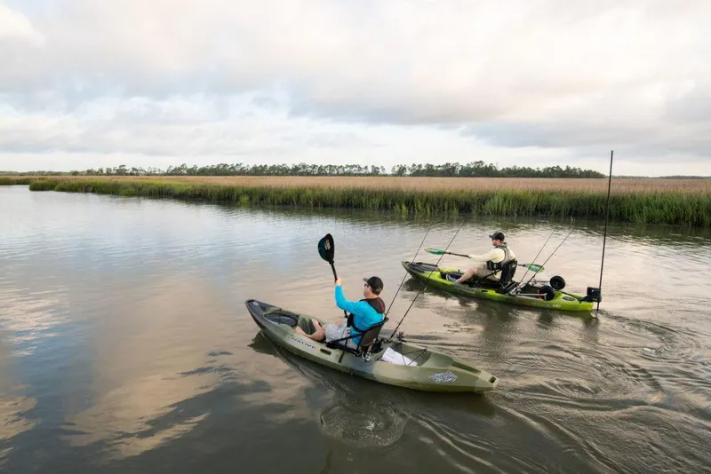Slide: The Image of Two people kayaking and fishing in Native Watercraft Stingray 11.5 kayaks, 2022 model. - 7