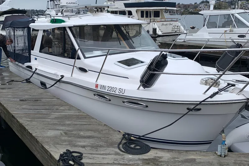 Slide: The Image of 2019 Cutwater C-28 boat docked at marina. - 1