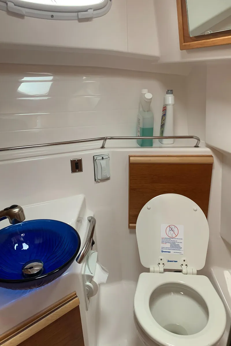 Slide: The Image of Bathroom in 2019 Cutwater C-28 boat with blue sink. - 10