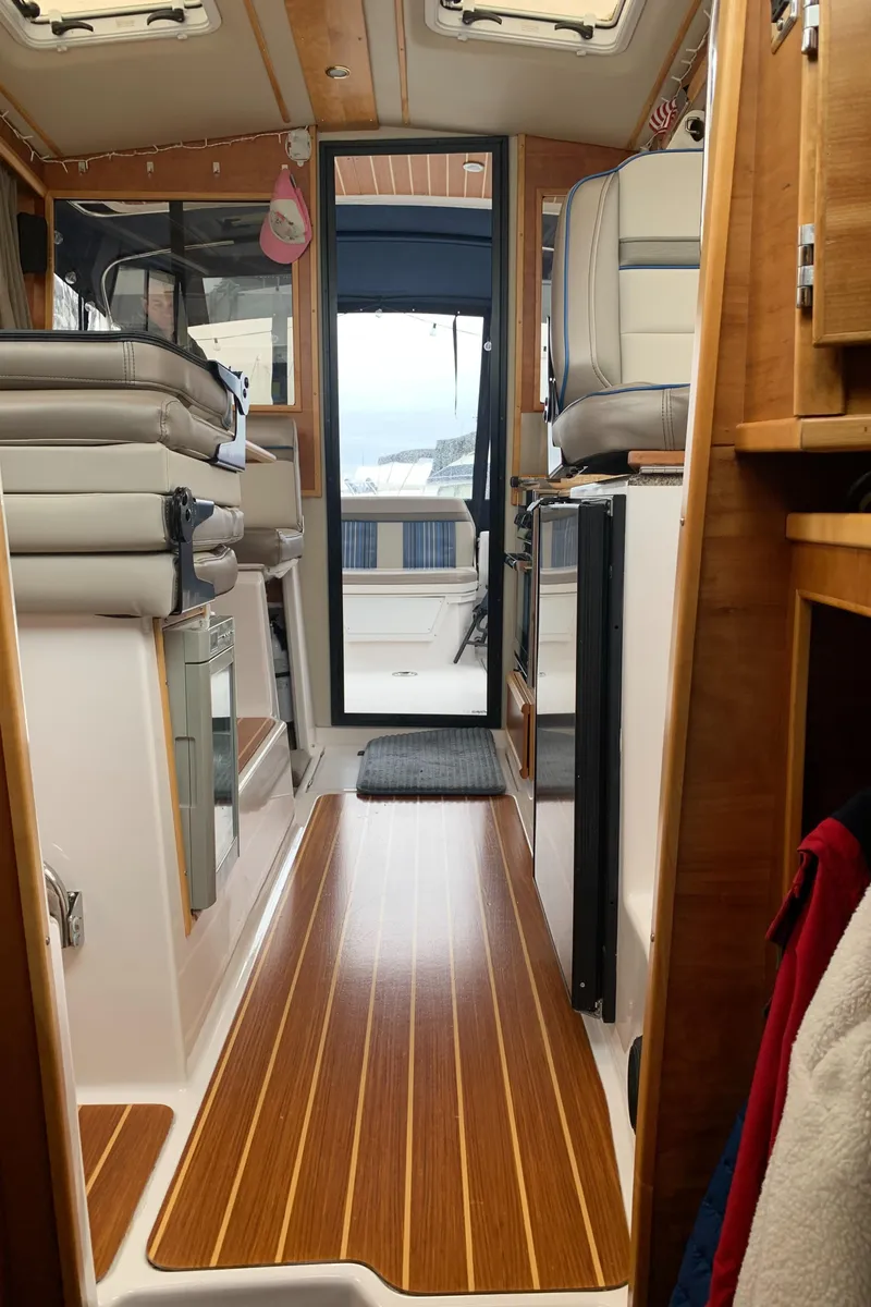 Slide: The Image of Interior of 2019 Cutwater C-28 yacht with wooden flooring. - 11
