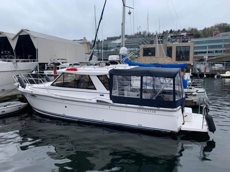Slide: The Image of 2019 Cutwater C-28 boat docked at marina. - 21