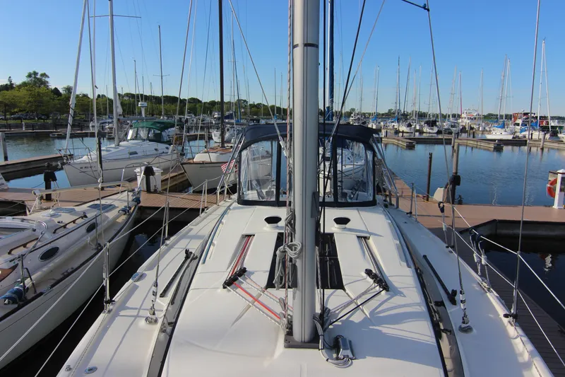 Slide: The Image of A 2015 Marlow-Hunter 37 sailboat docked in a busy marina. - 12