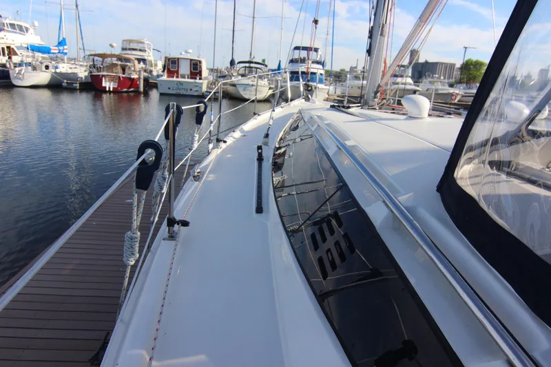 Slide: The Image of A 2015 Marlow-Hunter 37 docked, with other boats visible in the background. - 20