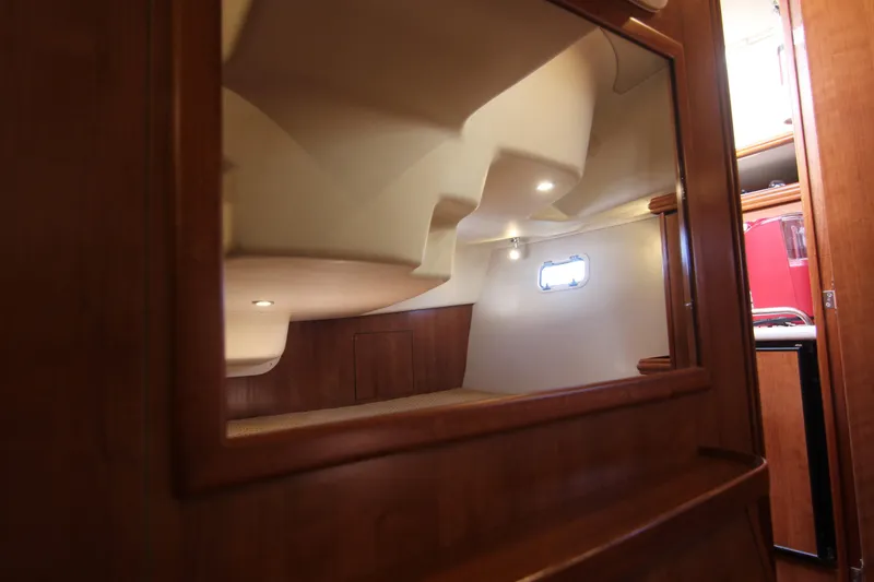 Slide: The Image of Interior of a 2015 Marlow-Hunter 37 with wood paneling and a small window. - 42