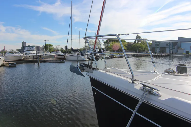 Slide: The Image of A 2015 Marlow-Hunter 37 is docked in a calm marina. - 5