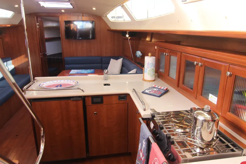 Slide: The Image of Interior of a 2015 Marlow-Hunter 37 featuring a kitchen and seating area. - 30