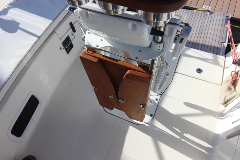 Slide: The Image of The image shows the cockpit of a 2015 Marlow-Hunter 37 with a wooden table. - 26
