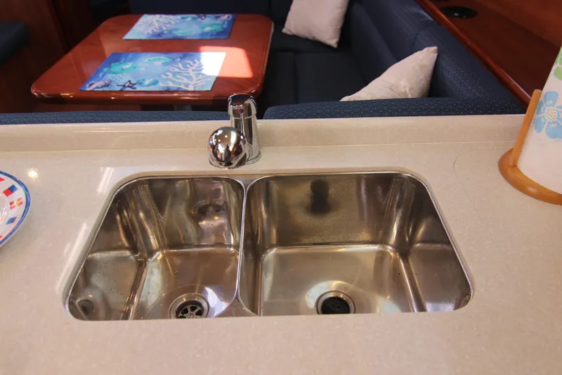 Slide: The Image of The galley of a 2015 Marlow-Hunter 37 features a double sink and a table. - 35