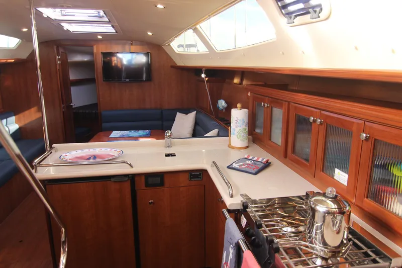 Slide: The Image of Interior of a 2015 Marlow-Hunter 37 featuring a kitchen and seating area. - 36