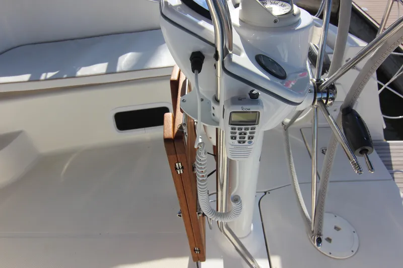 Slide: The Image of The image shows the cockpit of a 2015 Marlow-Hunter 37 with steering and instruments. - 24