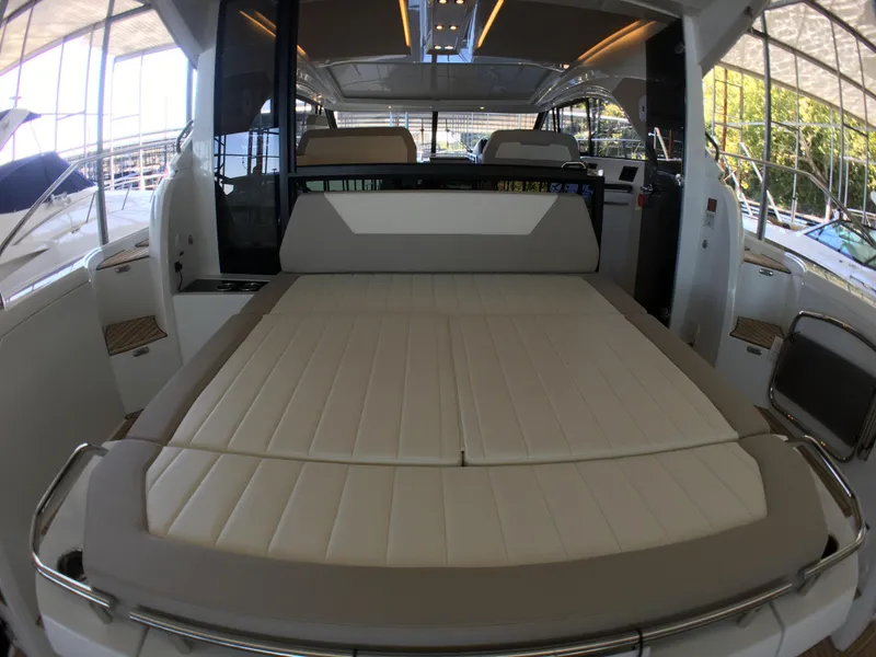 Slide: The Image of Interior of a 2017 Jeanneau Leader 46 yacht with lounging area. - 10