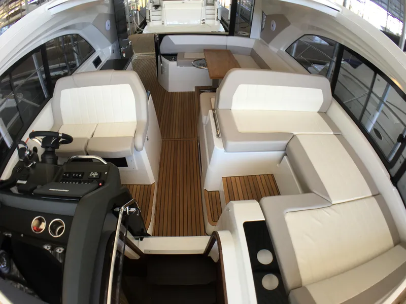 Slide: The Image of Interior of a 2017 Jeanneau Leader 46 yacht with elegant white seating. - 19