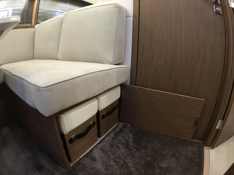 Slide: The Image of Interior of 2017 Jeanneau Leader 46 yacht with beige sofa and storage. - 27