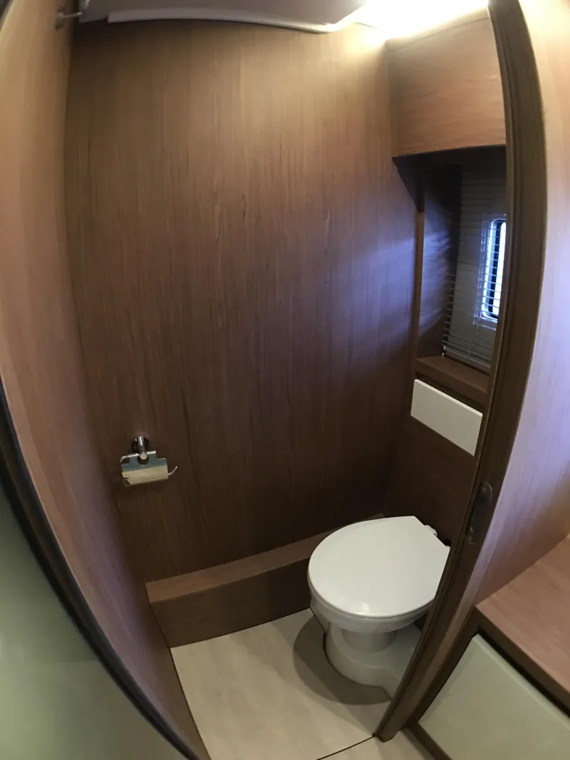 Slide: The Image of Bathroom in 2017 Jeanneau Leader 46 with wooden walls and toilet. - 35
