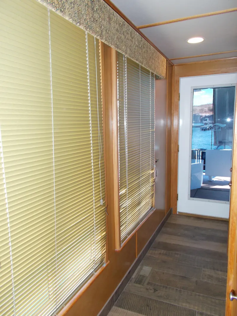 Slide: The Image of 2003 Stardust Cruisers For Shore 6 interior hallway with wooden accents and large windows. - 29