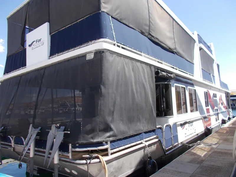 Slide: The Image of 2003 Stardust Cruisers For Shore 6 houseboat with shared ownership, docked at marina. - 3