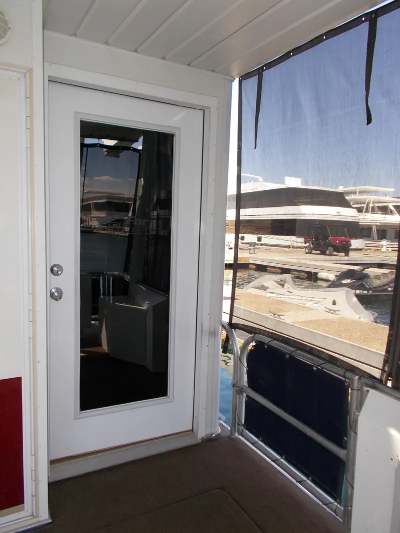 Slide: The Image of 2003 Stardust Cruisers For Shore 6, boat interior with glass door and marina view. - 33