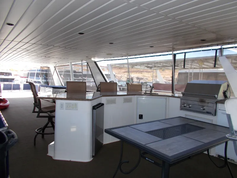 Slide: The Image of 2003 Stardust Cruisers For Shore 6 interior with bar, grill, and seating area. - 37