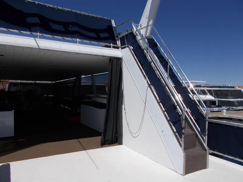 Slide: The Image of 2003 Stardust Cruisers For Shore 6 yacht, featuring stairs and shaded deck area. - 39