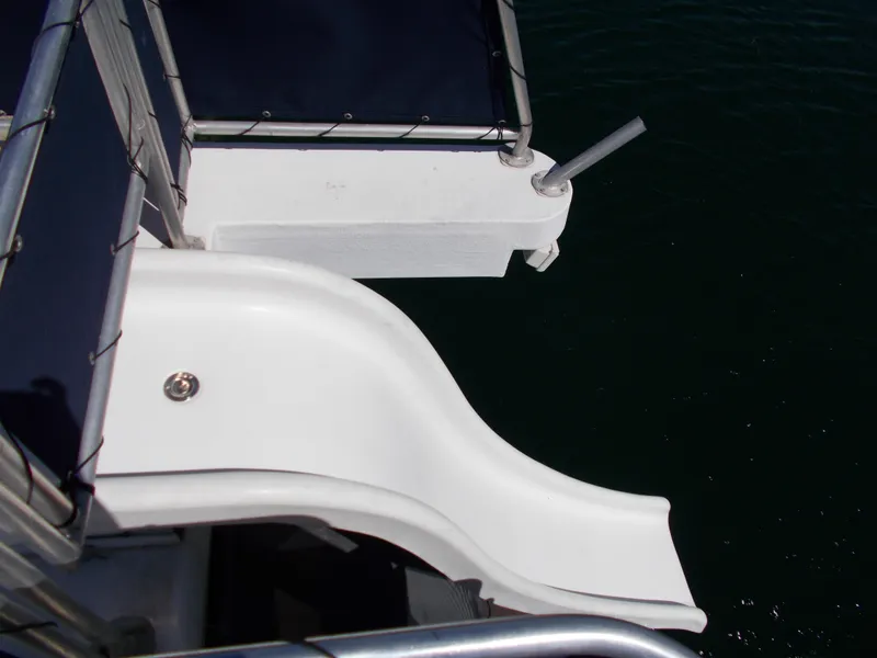 Slide: The Image of 2003 Stardust Cruisers houseboat slide over water, featuring sleek design and shared ownership model. - 40