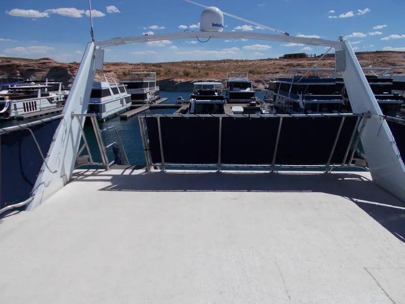 Slide: The Image of 2003 Stardust Cruisers For Shore 6 houseboat docked at marina under clear blue sky. - 42