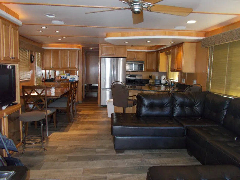 Slide: The Image of Luxurious interior of 2003 Stardust Cruisers For Shore 6 houseboat with modern kitchen and seating area. - 5
