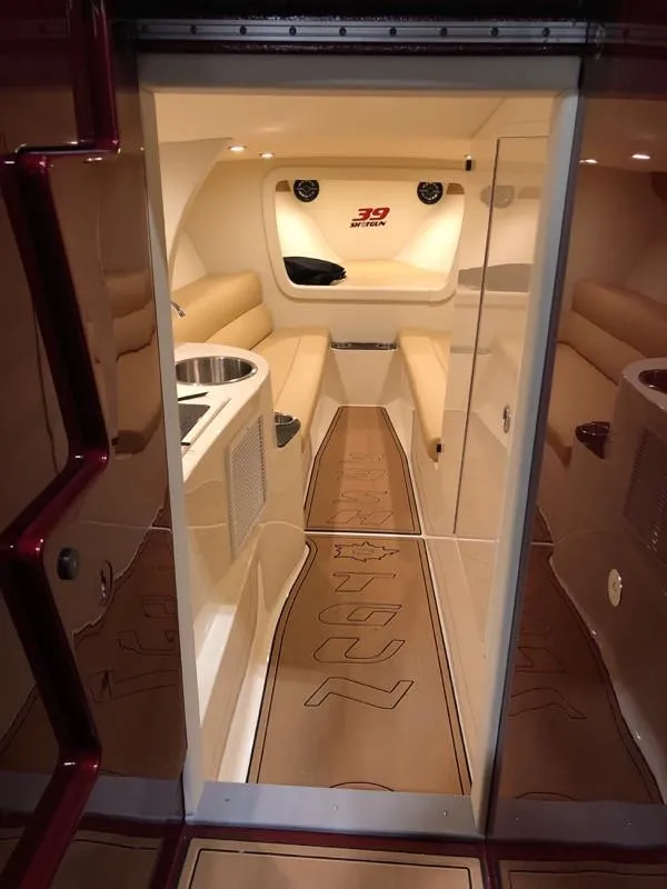 Slide: The Image of Interior of 2025 Hustler 39 Shotgun boat with luxurious seating and modern design. - 12