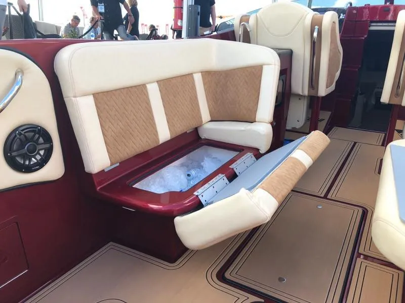 Slide: The Image of Hustler 39 Shotgun 2025 boat with open seat storage compartment and ice chest. - 19