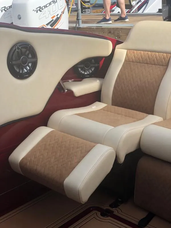 Slide: The Image of Luxurious interior of 2025 Hustler 39 Shotgun boat with beige and brown seating. - 23