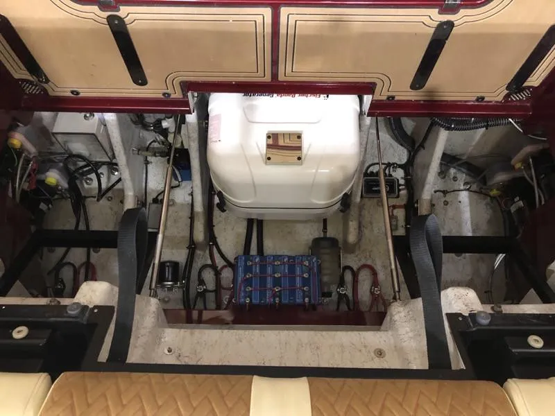 Slide: The Image of 2025 Hustler 39 Shotgun engine compartment with detailed wiring and components. - 28