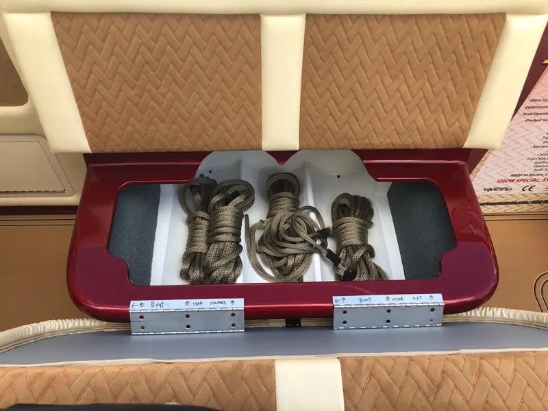 Slide: The Image of Storage compartment with ropes in a 2025 Hustler 39 Shotgun boat. - 29