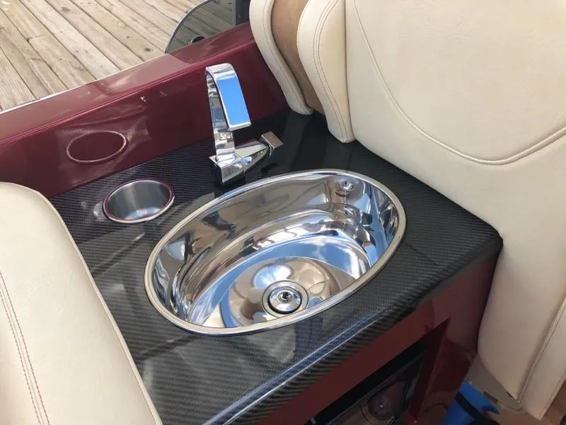 Slide: The Image of Luxury sink and faucet on the 2025 Hustler 39 Shotgun boat. - 31