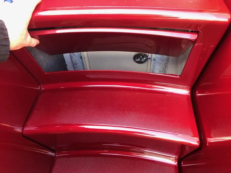 Slide: The Image of 2025 Hustler 39 Shotgun boat interior with red glossy finish. - 8