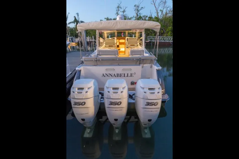 Slide: The Image of 2023 MJM 43z boat with triple 350 horsepower engines docked. - 5