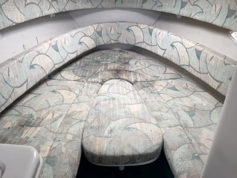 Slide: The Image of Interior cabin of 1992 Chris-Craft 232 Crowne with patterned upholstery. - 6
